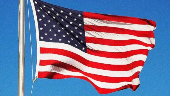 American flag waving in the wind during an Independence Day celebration.