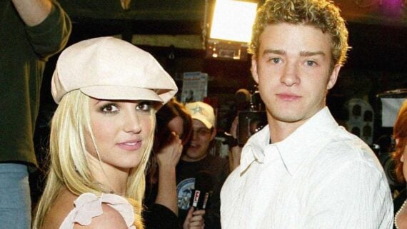 Britney Spears and Justin Timberlake posing together at a red carpet event during their relationship in the early 2000s.