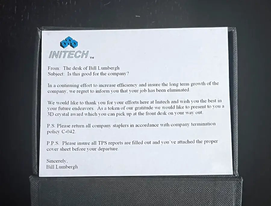 A printed memo from INITECH on white paper, signed by Bill Lumbergh, informs an employee their job is eliminated, thanks them, and requests the return of company staplers and TPS reports before departure.