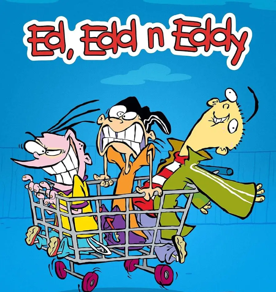 Three cartoon boys from "Ed, Edd n Eddy" are grinning and riding a shopping cart against a blue background. One boy pushes while the other two ride inside, looking excited and mischievous. The show's title is above them.