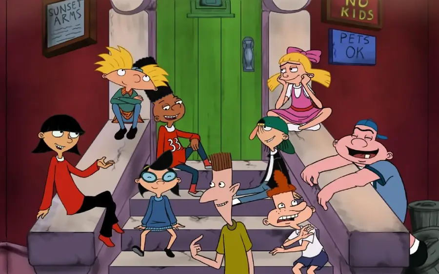 A group of cartoon kids from "Hey Arnold!" sit and talk on the steps of a building, smiling and laughing together. A green door and signs are visible in the background.