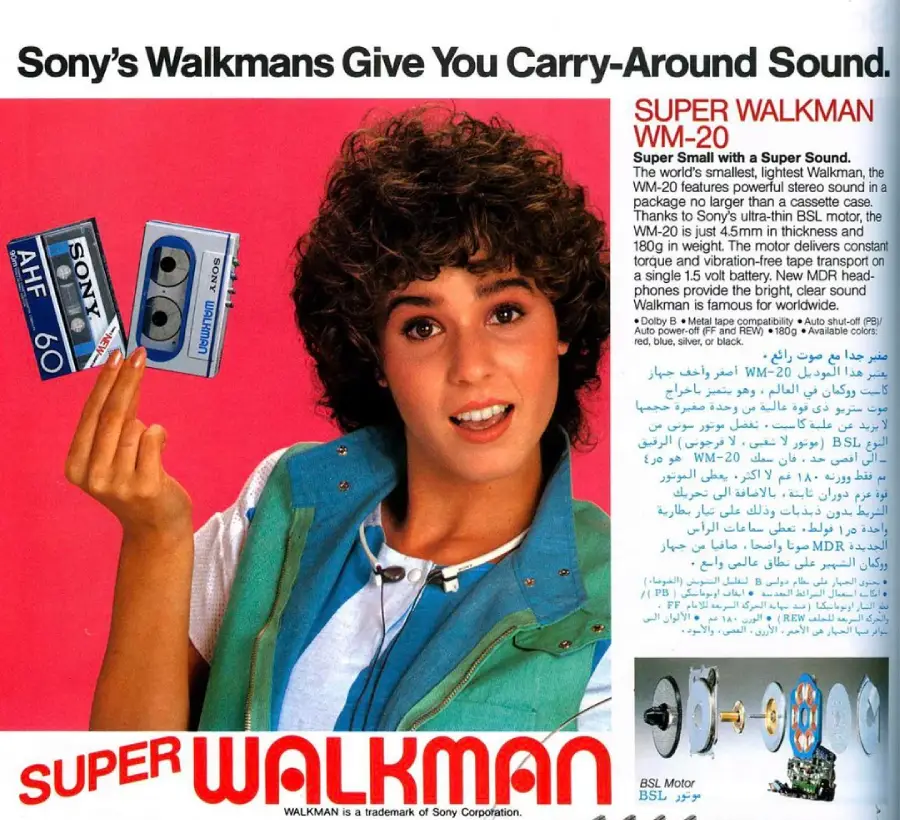 A smiling woman with curly hair holds up a Sony Walkman and a cassette tape. Text promotes the Sony Walkman WM-20, highlighting its small size and portable music features.