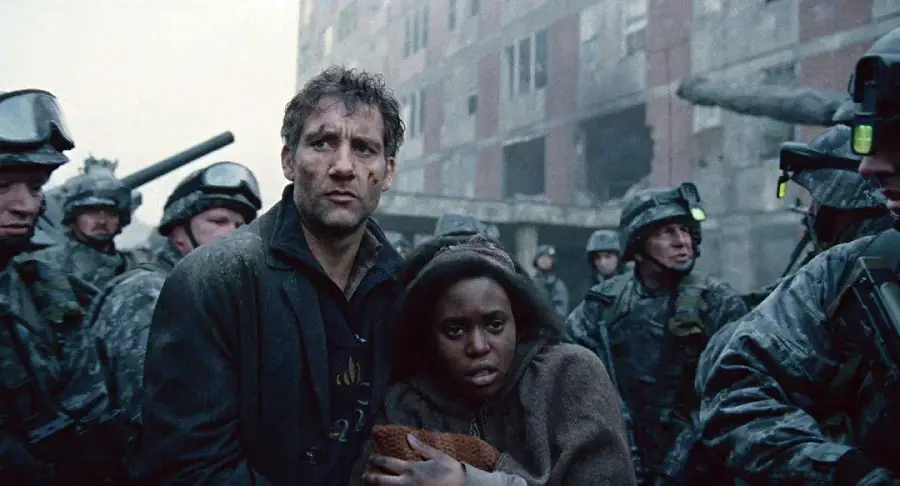 A man and a young woman huddle together, looking worried, as armed soldiers in riot gear surround them against the backdrop of a damaged, abandoned building.