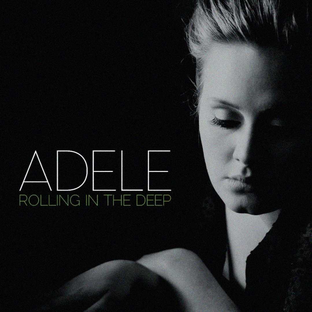 Black-and-white album cover showing a woman with closed eyes, facing down, lit from the side. Text reads “ADELE” in large letters and “ROLLING IN THE DEEP” below in smaller green font.