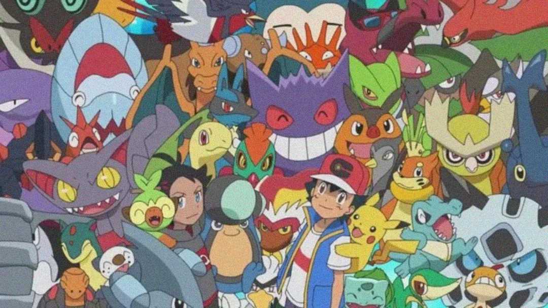 A colorful group illustration featuring Ash Ketchum, another Pokémon trainer, and many Pokémon of various types and expressions, all closely gathered and smiling or posing energetically.