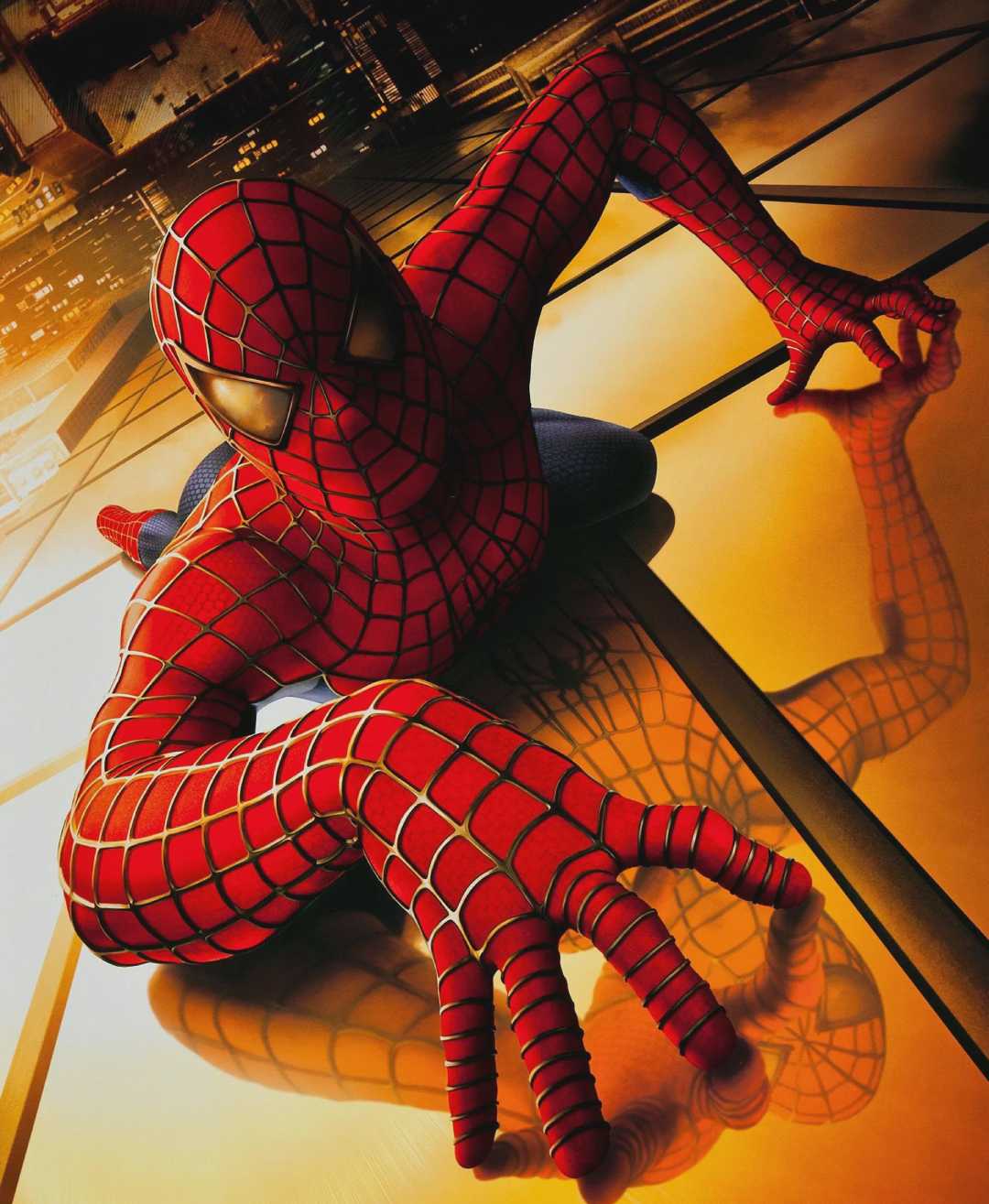 Spider-Man in his red and blue suit climbs a reflective, golden building, reaching forward with one hand while looking ahead, with a cityscape blurred in the background.