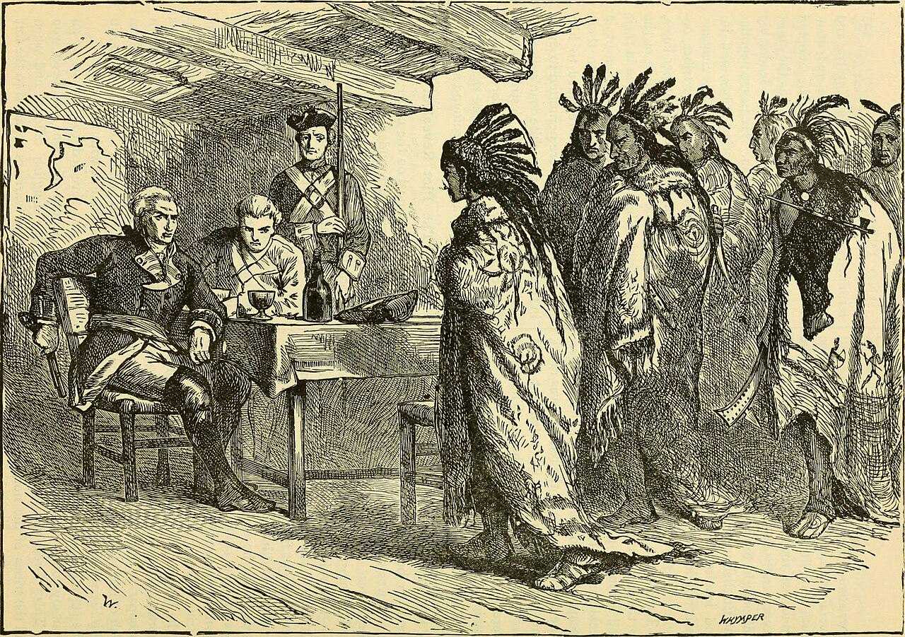 Black-and-white illustration of a meeting between European officers seated at a table and a group of Native Americans standing, some wearing feathered headdresses and cloaks, inside a rustic wooden room.