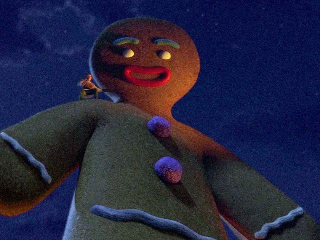A giant gingerbread man with purple buttons stands outdoors at night, looking down with a big red smile. A small figure sits on its shoulder under a starry sky.