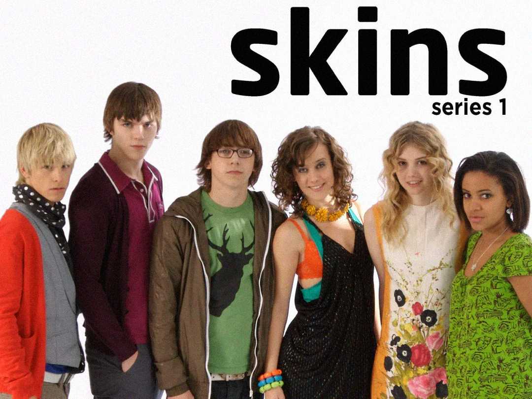 Six teenagers stand in a row against a white background with the text “skins series 1” above them. They are dressed in colorful, casual clothes, each with a distinct style and expression.