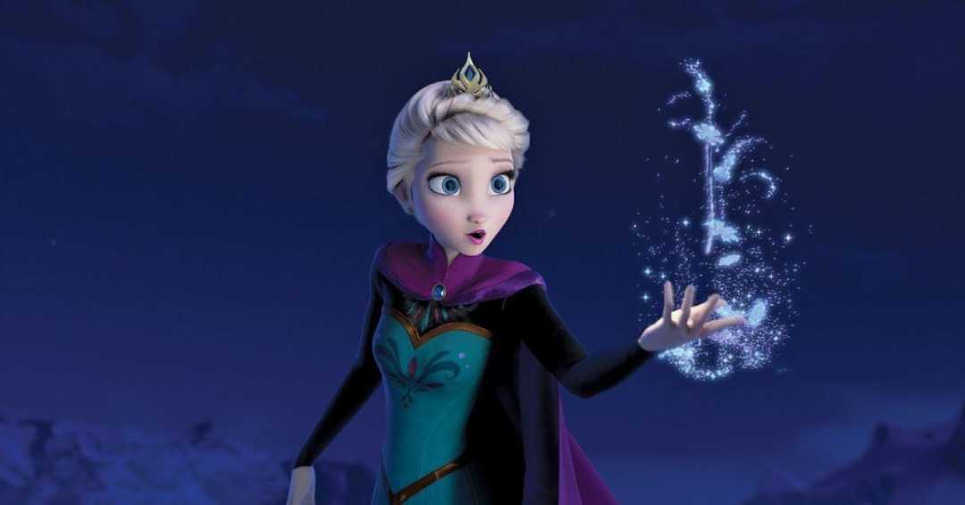 Animated woman with blonde hair and a crown, wearing a teal dress and purple cape, stands in a snowy landscape at night, creating sparkling ice magic from her hand.