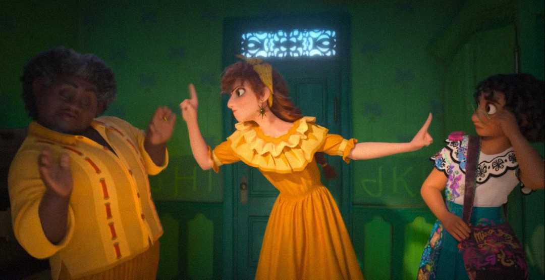Three animated women stand in a green room; one in yellow raises her hand between the others, who step back and watch her. The middle character looks serious, while the others react with surprise.