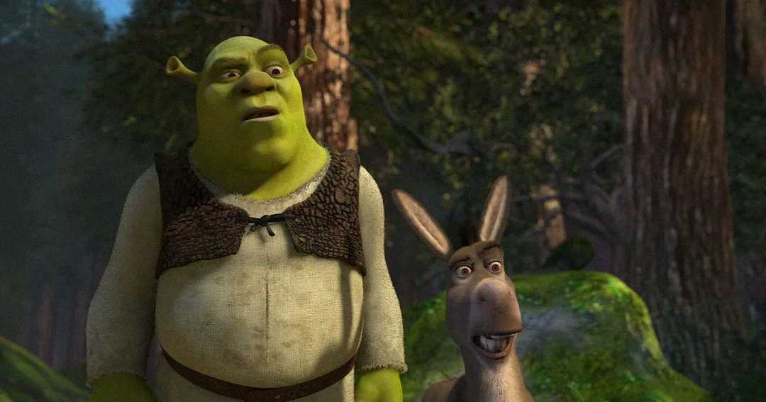 Shrek, a large green ogre, and Donkey, a gray donkey, stand together in a forest, both looking surprised or concerned. Sunlight filters through the trees behind them.
