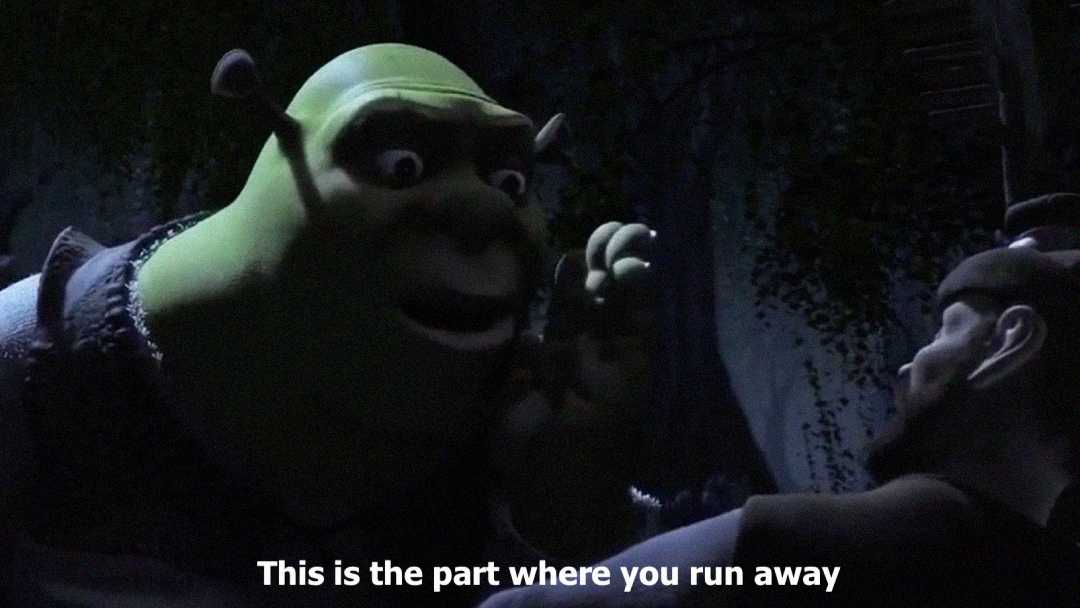 Shrek leans in and points while speaking to a frightened man in a dark, wooded setting. The caption at the bottom reads, "This is the part where you run away.