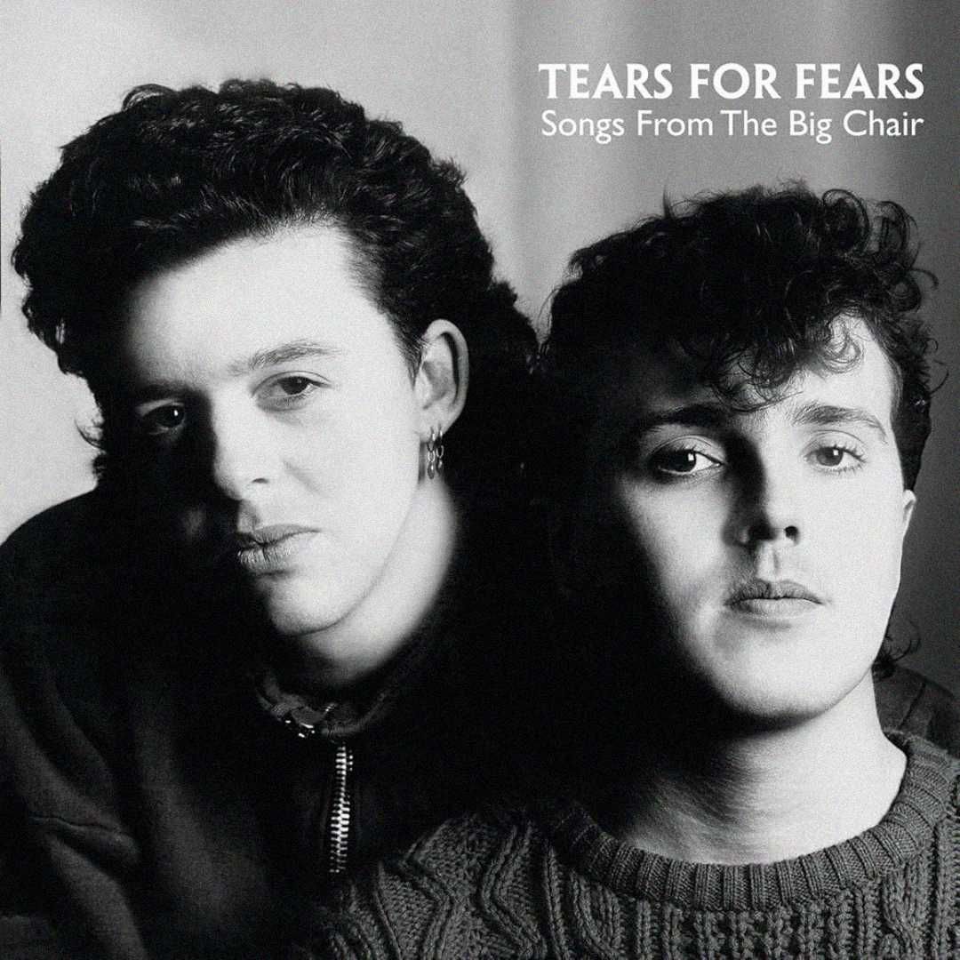 Black-and-white photo of two men with curly hair. Text in the top right reads "TEARS FOR FEARS Songs From The Big Chair." The men face the camera with serious expressions.