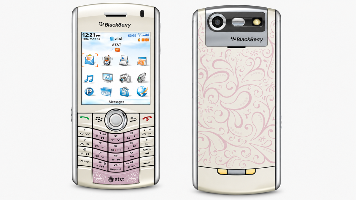 Front and back view of a white BlackBerry phone with a pink floral pattern, featuring a small screen, keypad, camera, and AT&T branding.