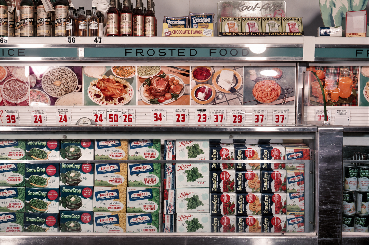 A grocery store freezer section labeled "Frosted Food" displays frozen vegetables in colorful boxes and cans. Above the shelves are vintage food images and prices. Bottles and other items sit on the top shelf.