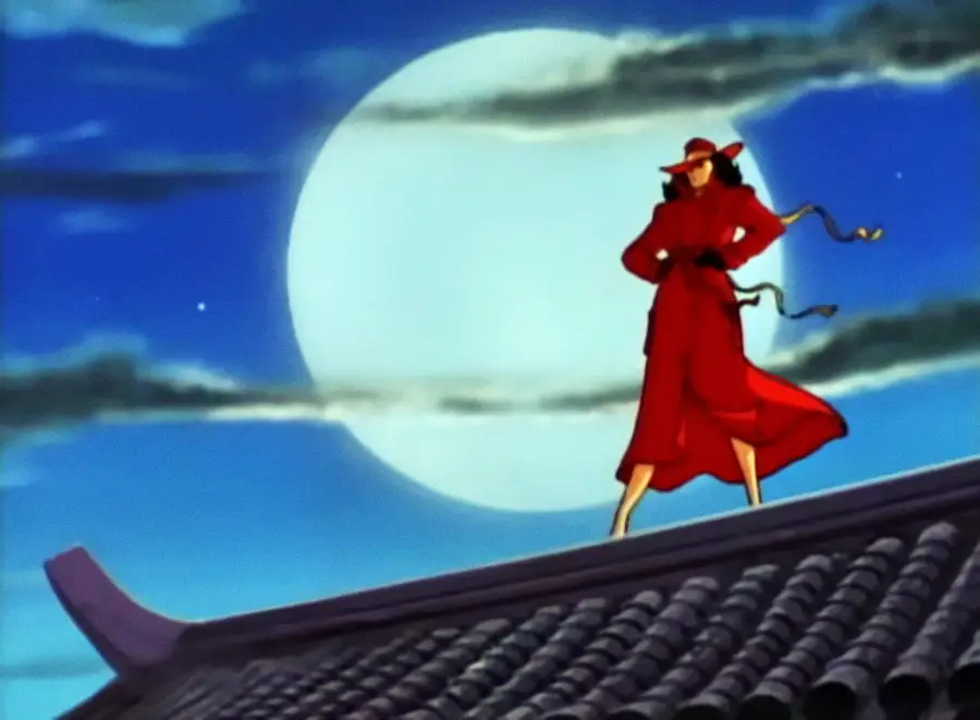 A figure in a red trench coat and hat stands confidently on a tiled rooftop at night, with a large full moon and clouds illuminating the sky behind them.