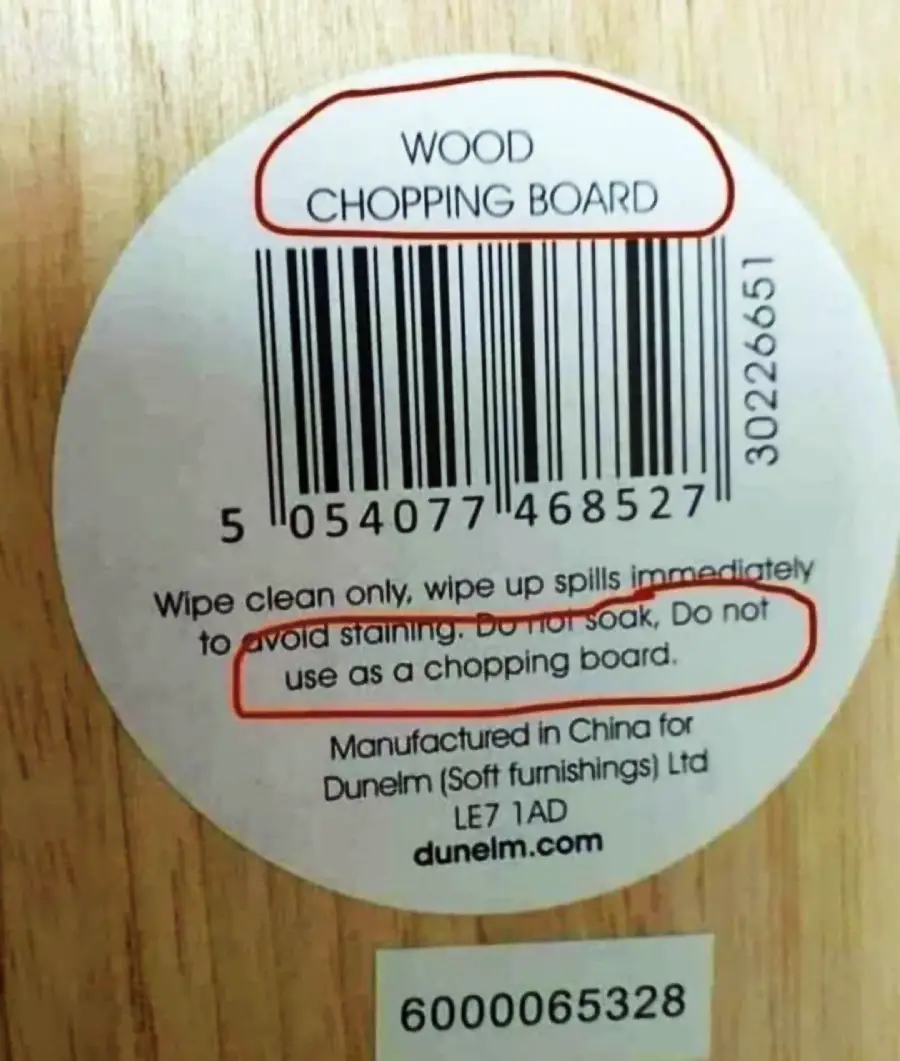A label reads "WOOD CHOPPING BOARD" but also says, "Do not use as a chopping board," and "Do not soak." Barcode and manufacturer details are visible.