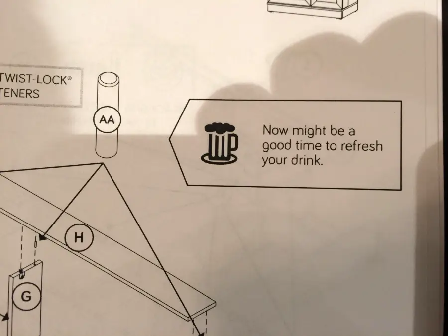 Instruction manual page with a drawing of a beer mug and the text: "Now might be a good time to refresh your drink." Assembly parts labeled "AA" and "H" are also visible.