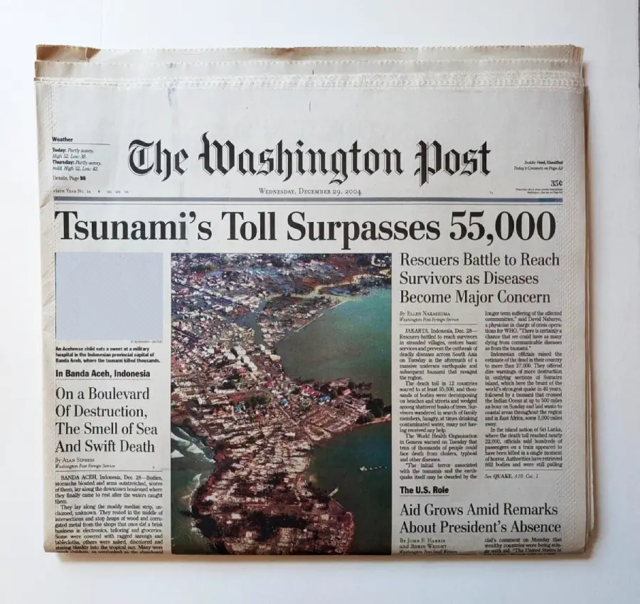 Front page of The Washington Post with the headline “Tsunami’s Toll Surpasses 55,000” and an aerial photo showing devastation along a coastline, dated Wednesday, December 29, 2004.