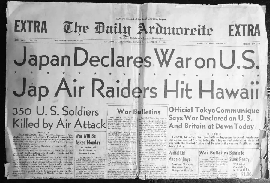 Black and white newspaper front page from December 7, 1941, with large headline: "Japan Declares War on U.S.; Jap Air Raiders Hit Hawaii." Subheadings mention U.S. soldiers killed and official Tokyo communique.