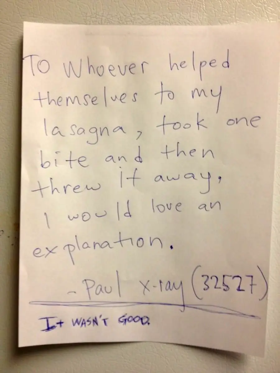A handwritten note on white paper reads: "To whoever helped themselves to my lasagna, took one bite and then threw it away, I would love an explanation. - Paul x-ray (32527)". Below, in blue ink: "It wasn't good.