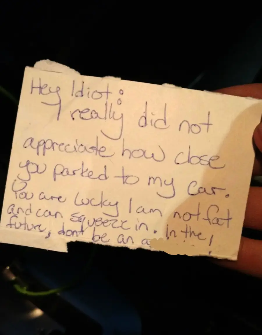 A handwritten note reads: "Hey idiot; I really did not appreciate how close you parked to my car. You are lucky I am not fat and can squeeze in. In the future, don't be an a**!
