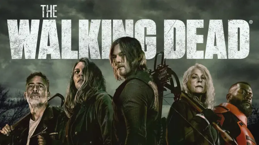 Five characters from "The Walking Dead" stand in front of a dark, eerie background with the show's title in large, distressed white letters above them. Each character looks serious and ready for action.