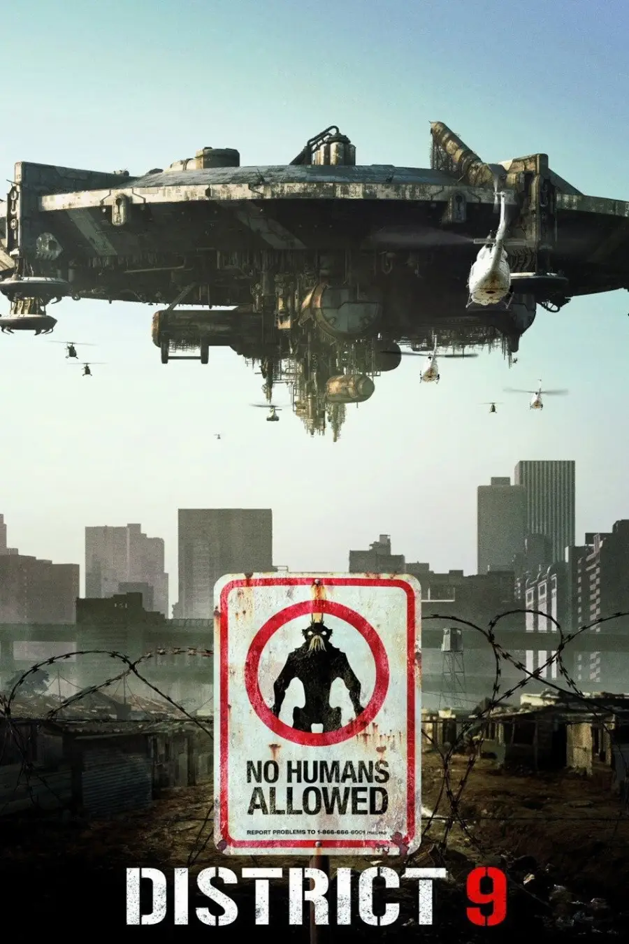 A large, hovering alien spaceship looms over a city skyline. In the foreground, a barbed wire fence frames a warning sign that reads "No Humans Allowed." The title "District 9" is at the bottom of the image.