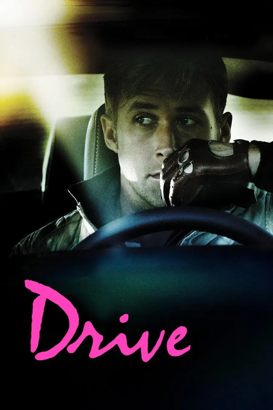 A man wearing a driving glove sits behind the wheel of a car at night, looking pensively to the side. The word "Drive" appears in bold pink script at the bottom of the image.