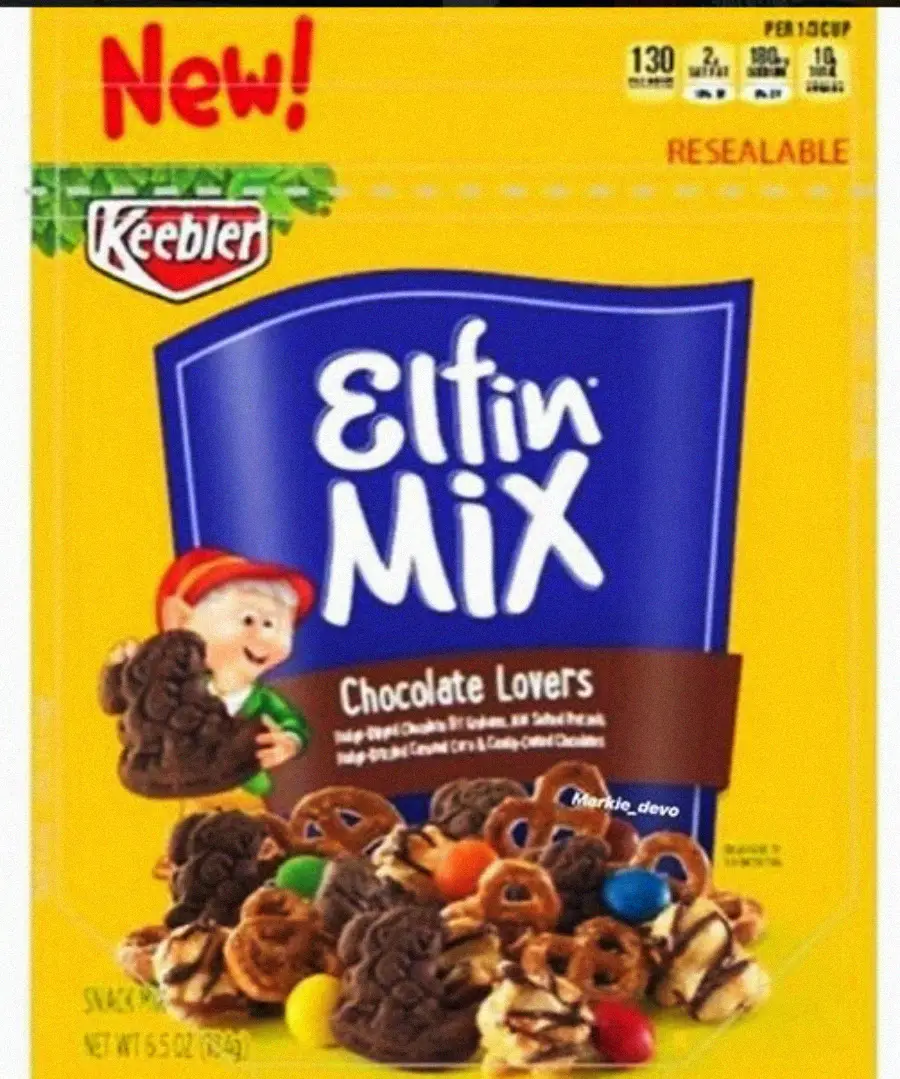 A yellow resealable bag of Keebler Elfin Mix Chocolate Lovers snack mix features a cartoon elf, images of chocolate cookies, pretzels, and colorful candy pieces on the front. The bag displays “New!” in red at the top.
