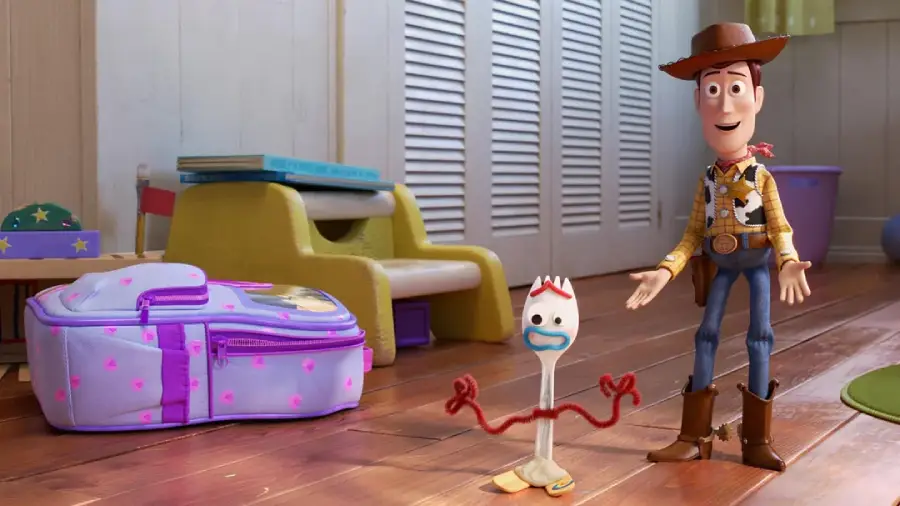 A purple suitcase sits on a wooden floor next to two animated characters: Woody, a cowboy doll in a hat and boots, and Forky, a spork with red pipe cleaner arms, both from Toy Story, standing inside a child's room.
