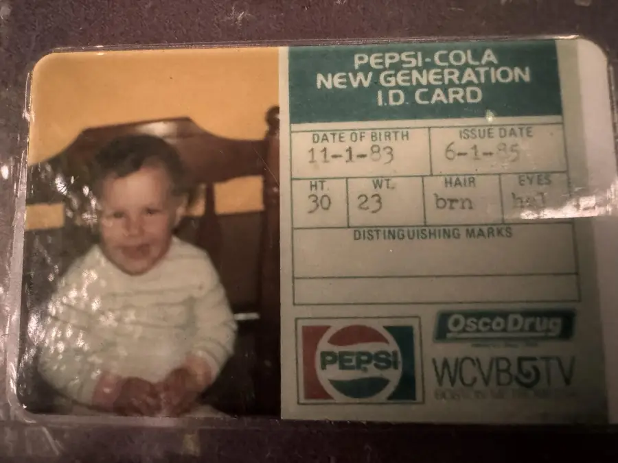 A vintage Pepsi-Cola New Generation ID card showing a baby’s photo, birthdate, height, weight, hair and eye color, and logos for Pepsi, Osco Drug, and WCVB5TV.