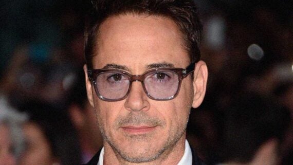 Robert Downey Jr. smiling on the red carpet after his remarkable career comeback.