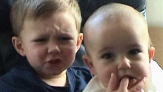 Two young brothers in the iconic Charlie Bit My Finger viral YouTube video.