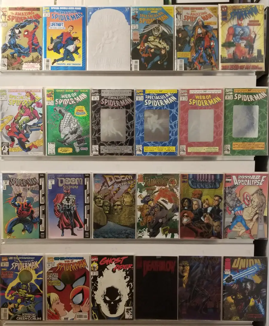 A display of various Marvel comic books arranged in four rows, featuring Spider-Man, Doctor Doom, Fantastic Four, and others; some covers are obscured by white placeholders.