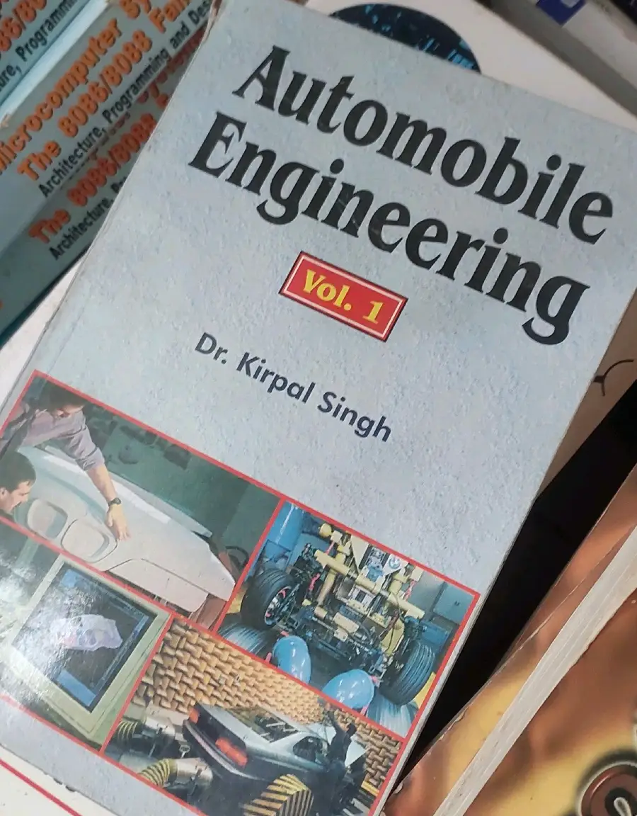 Book cover of "Automobile Engineering Vol. 1" by Dr. Kirpal Singh. The cover features automotive images including a car, engine parts, and engineering equipment.