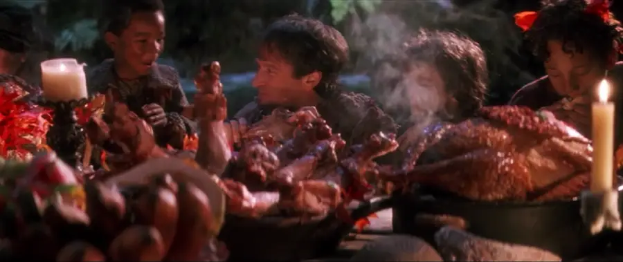 A group of children and an adult sit around a table filled with various meats, food, and candles, engaged in lively conversation in a festive, fantasy-like setting.