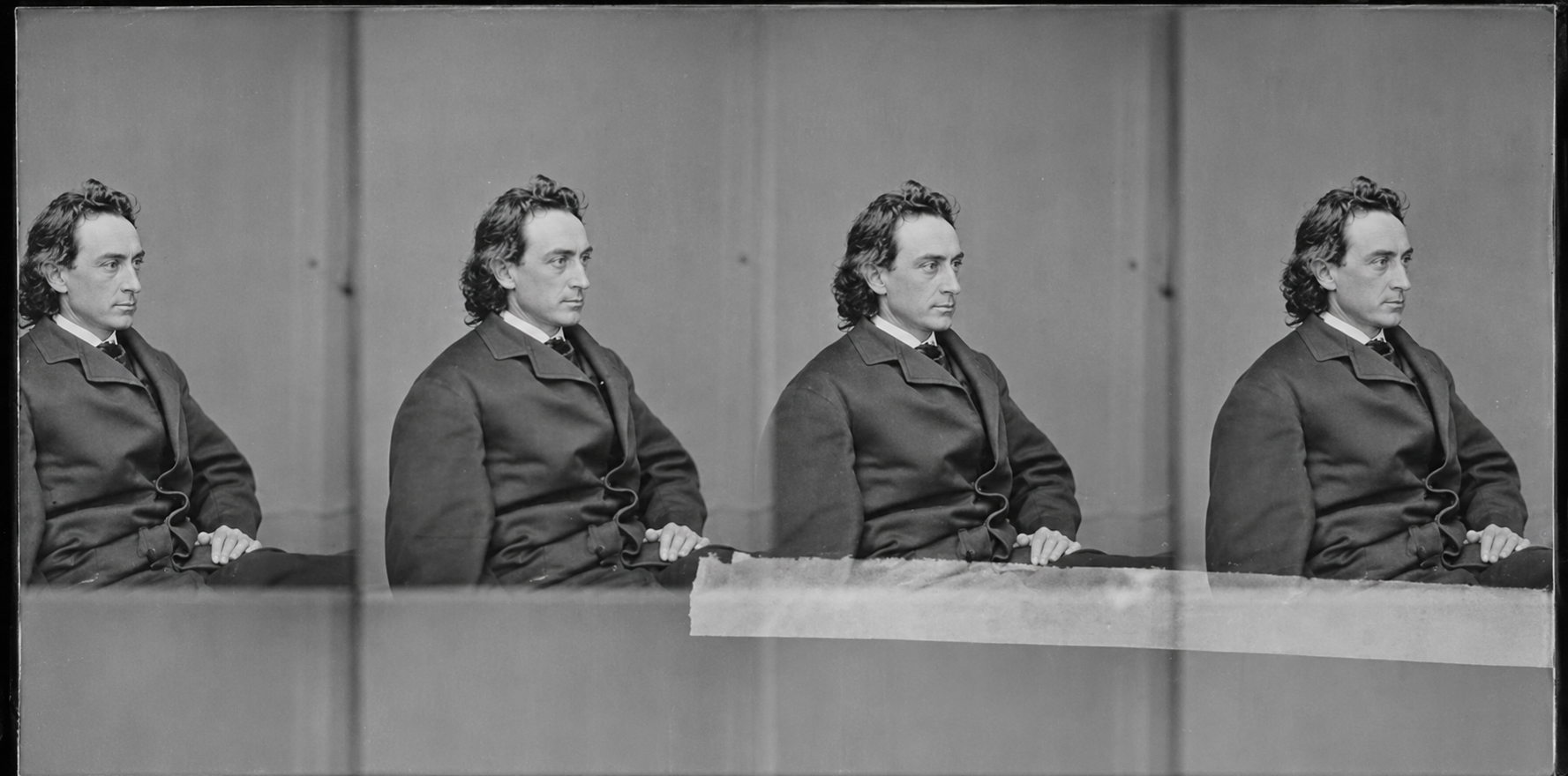 Black-and-white photo showing four identical images of a seated man with wavy hair, wearing a dark coat, facing left, arranged side by side against a plain background.