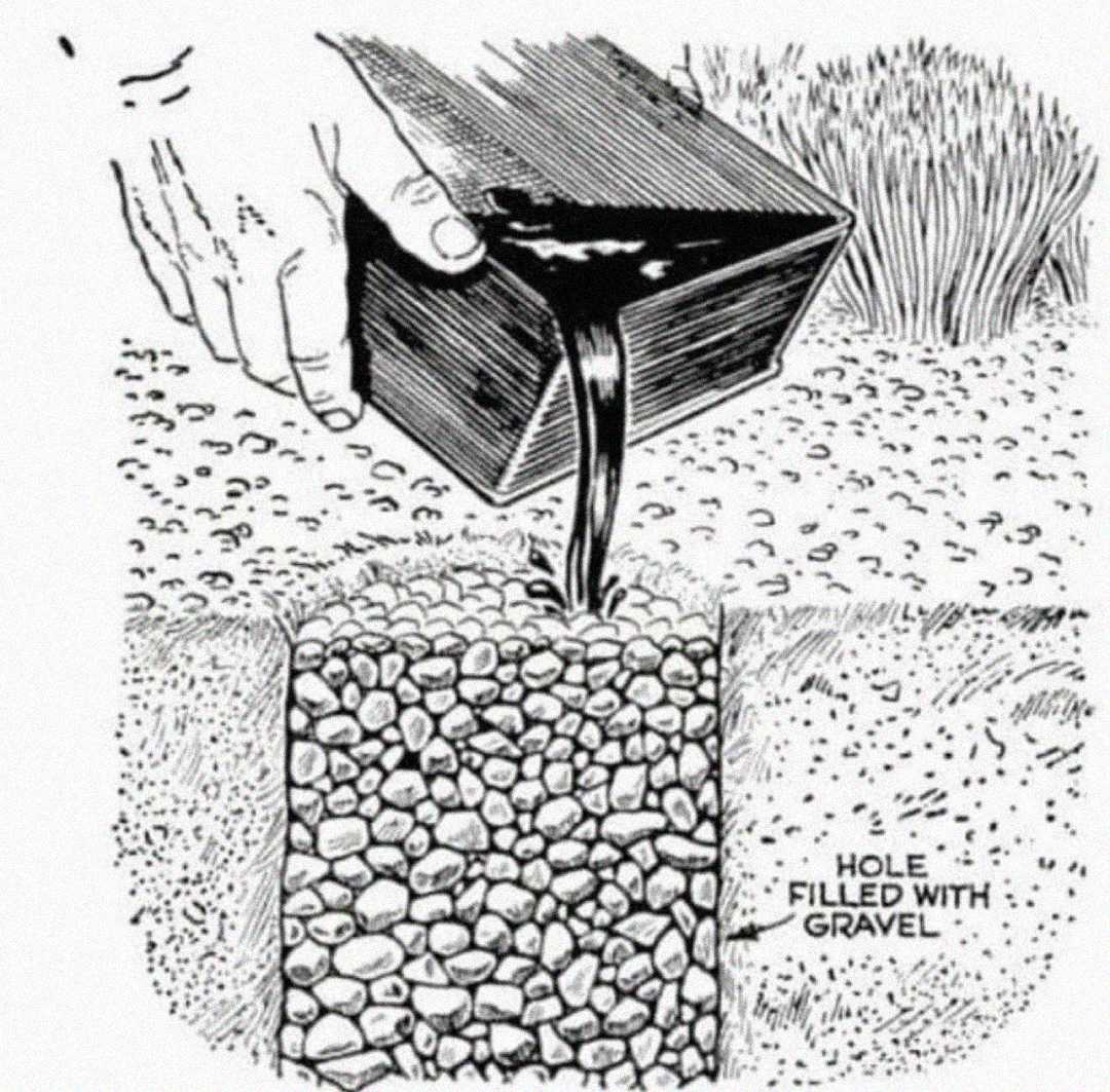 A hand pours liquid from a container into a hole filled with gravel, illustrating a step in a construction or landscaping process. The area is labeled "hole filled with gravel.