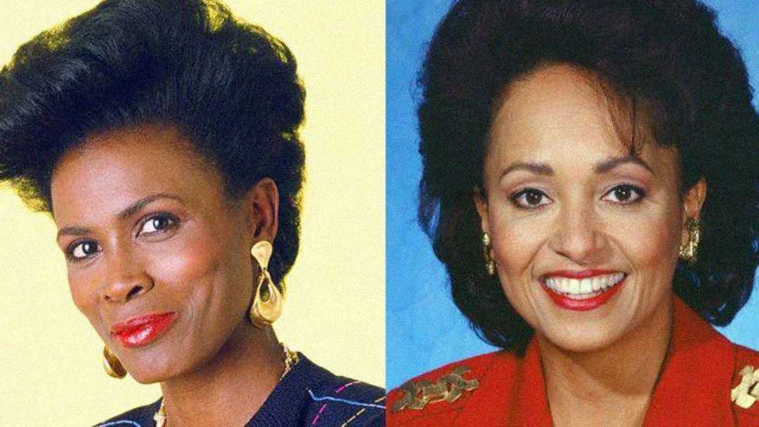 Side-by-side portraits of two women with dark hair. The woman on the left has short hair, gold earrings, and a patterned top. The woman on the right has shoulder-length hair, gold earrings, and a red blazer, both smiling at the camera.