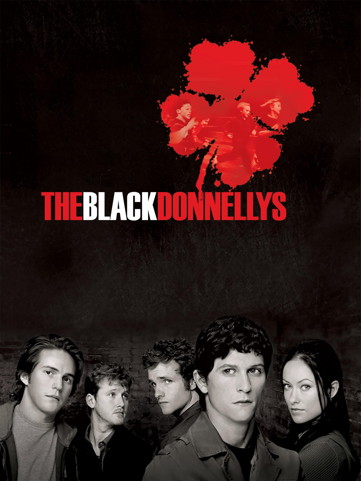 Five serious-looking people stand in a row below the title “The Black Donnellys” with a red clover containing faded character images above them, all against a dark background.
