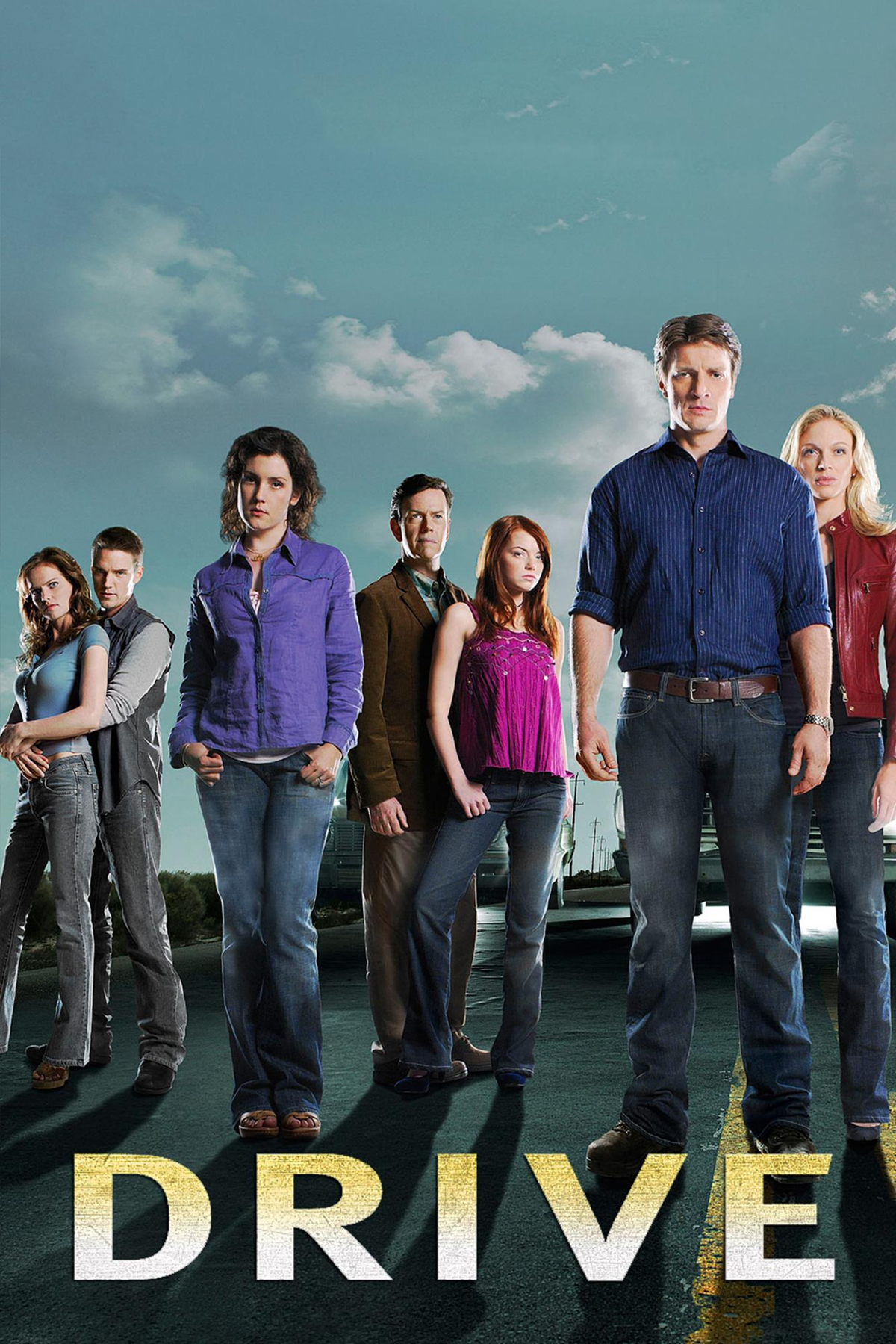Seven people stand on a road under a cloudy sky, looking serious. The word "DRIVE" appears in large letters at the bottom of the image.