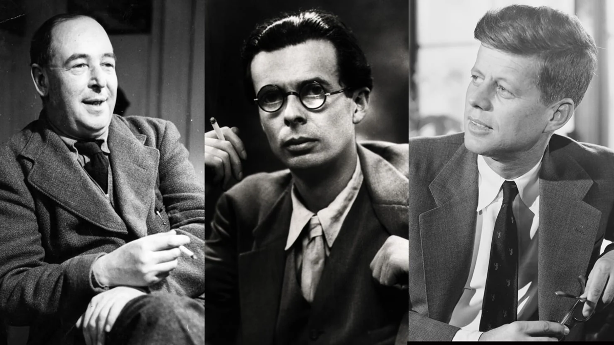 Three men in suits sit and look in different directions. The man on the left holds a cigarette, the center man wears glasses and holds a pen, and the man on the right looks to his left. All appear in black and white.
