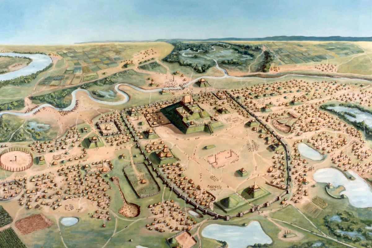 Aerial illustration of Cahokia, an ancient city with large earthen mounds, wooden structures, fields, rivers, and forests. The city is surrounded by water and farmland, with a central plaza and multiple pyramid-like mounds.