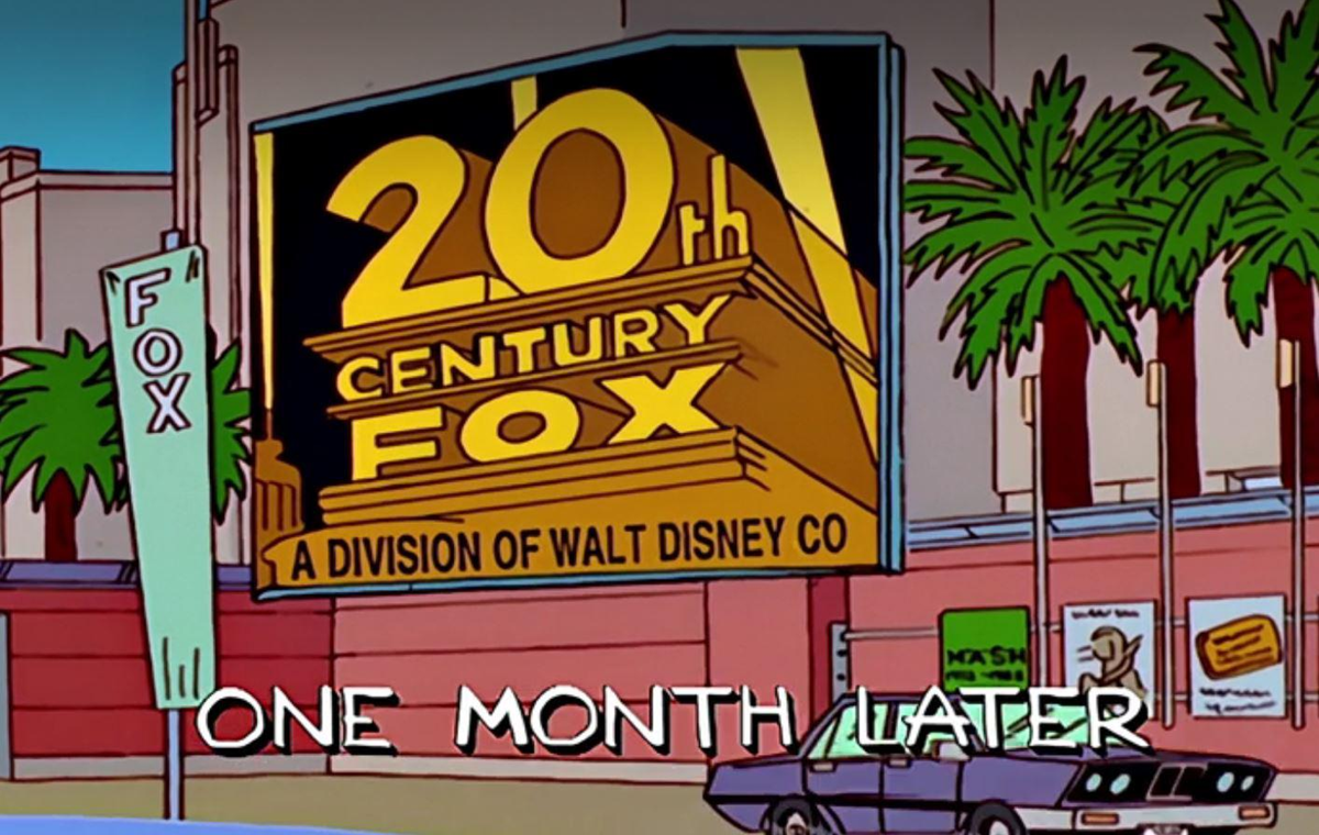 A large 20th Century Fox sign reads "A Division of Walt Disney Co" beside palm trees and a parked car. Text at the bottom says "ONE MONTH LATER.
