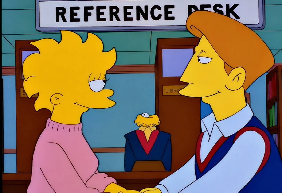 Two animated characters stand holding hands and looking at each other in front of a "REFERENCE DESK" sign, while a librarian in a blue suit watches from behind the desk.