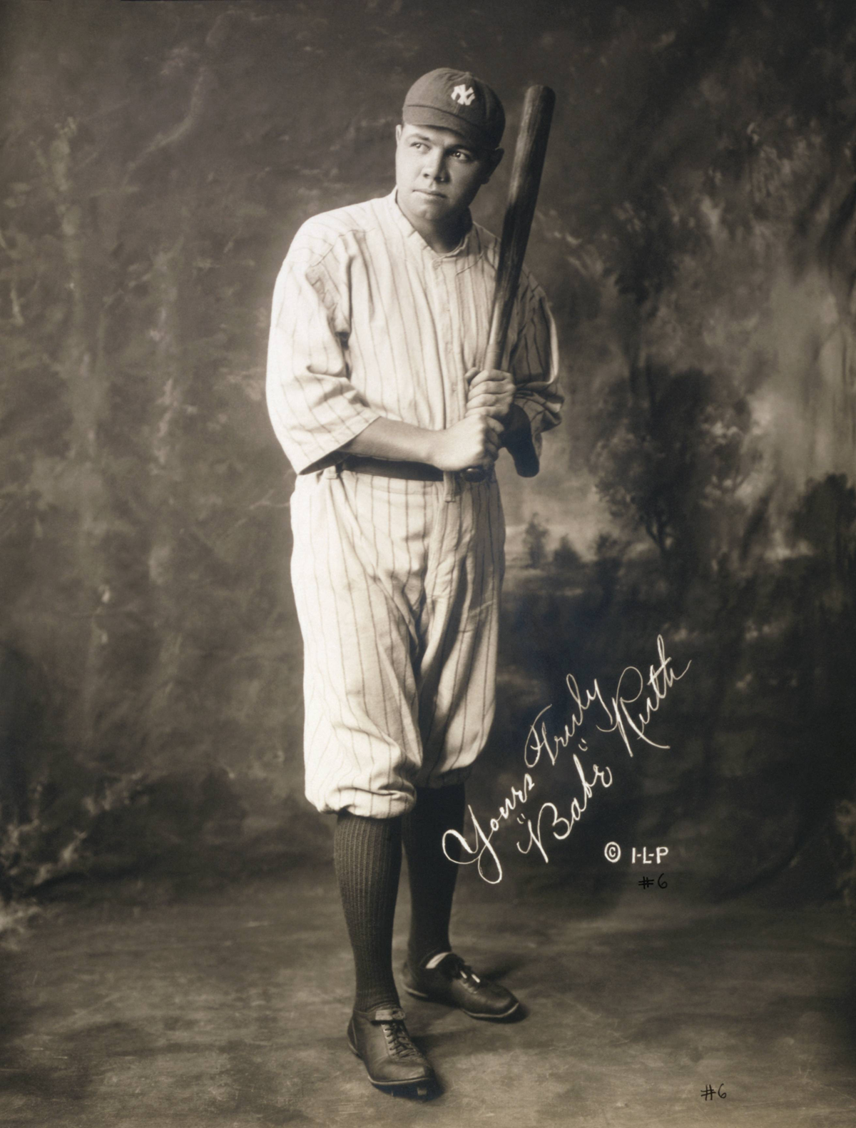 A baseball player in a striped uniform and cap stands holding a bat. The image is sepia-toned and includes a cursive autograph. The background is a painted studio setting.