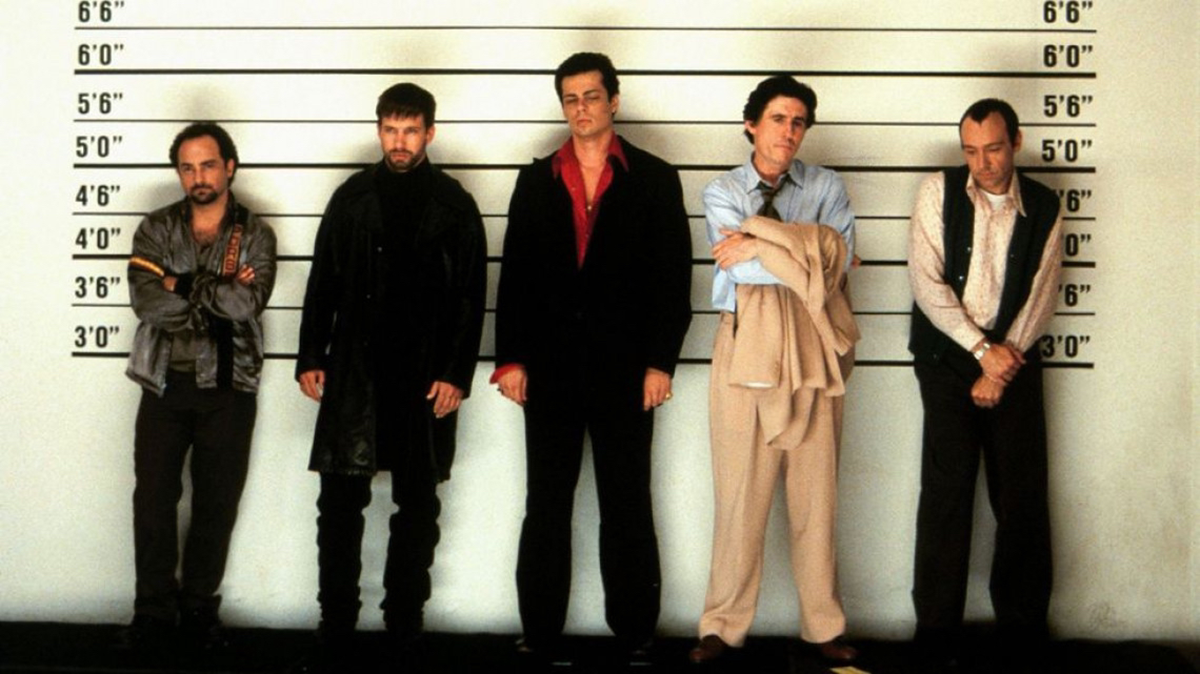 Five men stand in a police lineup against a height chart, each with different poses and expressions, dressed in 1990s-style clothing. The background is white with black height markings.