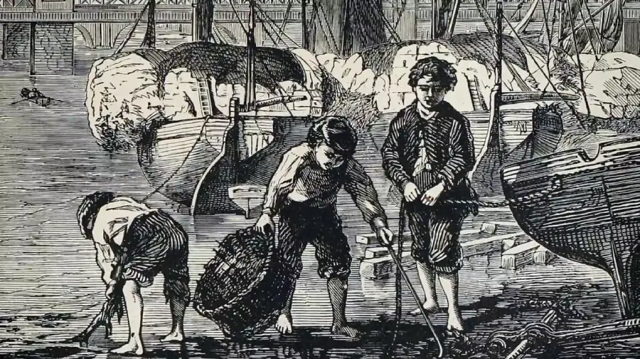An old black-and-white illustration shows three boys working barefoot by a busy dock, collecting items from the muddy ground near ships loaded with large bundles.